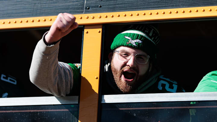 An Eagles fan celebrates at the Super Bowl parade.