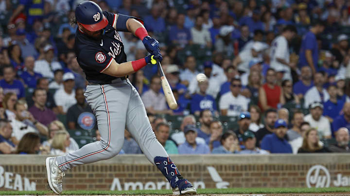 Washington Nationals third baseman Andres Chaparro hits an RBI single against the Chicago Cubs at Wrigley Field.