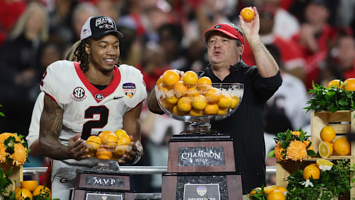 Dec 30, 2023; Miami Gardens, FL, USA; Georgia Bulldogs head coach Kirby Smart and running back Kendall Milton (2) react after the 2023 Orange Bowl at Hard Rock Stadium. Mandatory Credit: Sam Navarro-Imagn Images