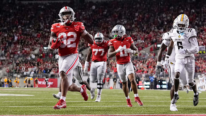 Sep 7, 2024; Columbus, Ohio, USA; Ohio State Buckeyes running back TreVeyon Henderson (32) runs for a touchdown during the second half of the NCAA football game against the Western Michigan Broncos at Ohio Stadium.