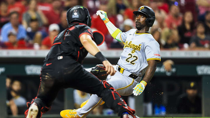 Pittsburgh Pirates designated hitter Andrew McCutchen (22) attempts to score on a single hit by third baseman Jared Triolo (not pictured) in the seventh inning against the Cincinnati Reds at Great American Ball Park.