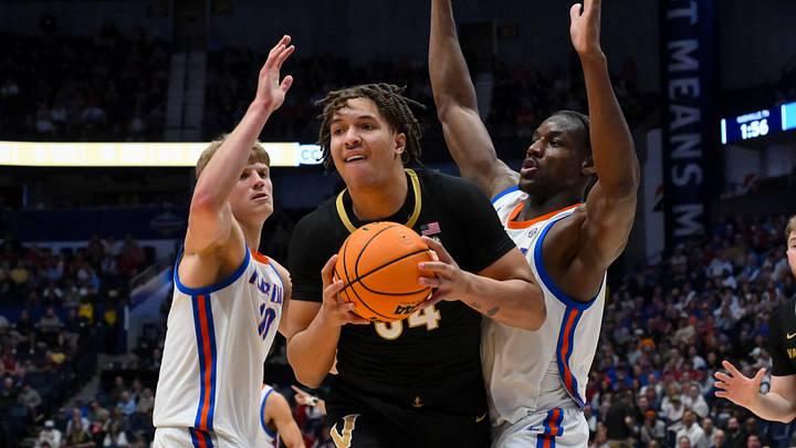 Mar 14, 2026; Nashville, TN, USA;  Vanderbilt Commodores center Jayden Leverett (34) and Florida Gators center Rueben Chinyelu (9) fight for the rebound during the second half at Bridgestone Arena. Mandatory Credit: Steve Roberts-Imagn Images