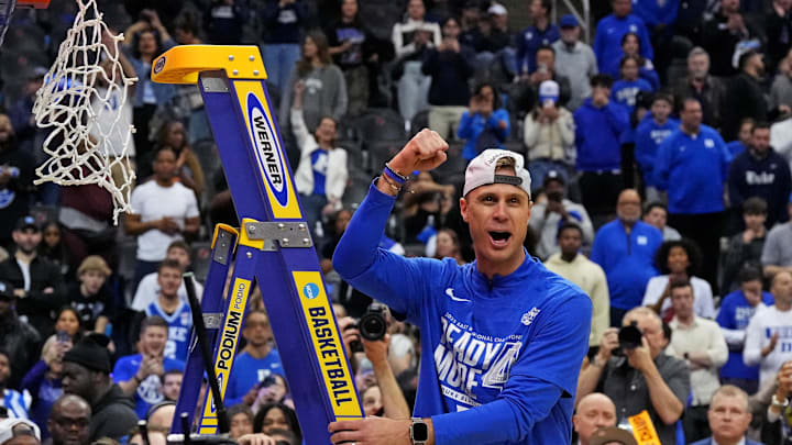 Duke Blue Devils head coach Jon Scheyer cuts down the net after the Duke Blue Devils beat the Alabama Crimson Tide in the East Regional final of the 2025 NCAA tournament at Prudential Center.
