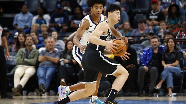 Oct 30, 2024; Memphis, Tennessee, USA; Brooklyn Nets guard Yongxi Cui (8) dribbles as Memphis Grizzlies forward Jaylen Wells (0) defends during the second half at FedExForum. Mandatory Credit: Petre Thomas-Imagn Images