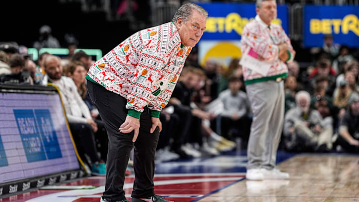 Michigan State head coach Tom Izzo, left, and Oakland head coach Greg Kampe watch a play during the first half at Little Caesars Arena in Detroit on Saturday, Dec. 20, 2025.