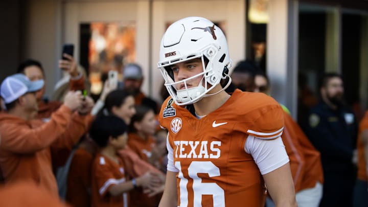 Dec 21, 2024; Austin, Texas, USA; Texas Longhorns quarterback Arch Manning (16) against the Clemson Tigers during the CFP National playoff first round at Darrell K Royal-Texas Memorial Stadium. Mandatory Credit: Mark J. Rebilas-Imagn Images