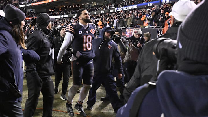 Caleb Williams celebrates the playoff win over Green Bay. Vegas lines currently favor the Bears in 12 games for 2026.