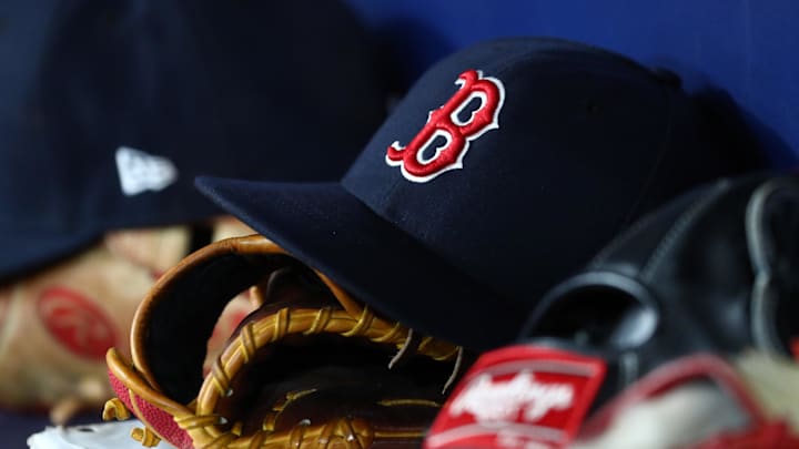 Sep 20, 2019; St. Petersburg, FL, USA; A detail view of Boston Red Sox hats and gloves at Tropicana Field. Mandatory Credit: Kim Klement-Imagn Images