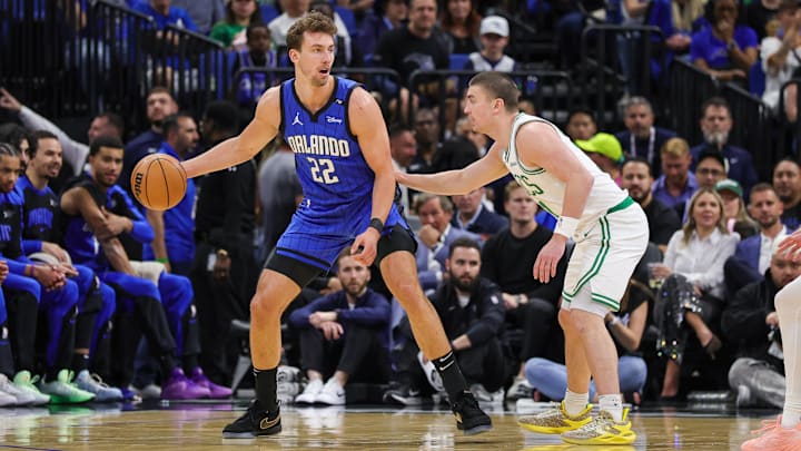 Boston Celtics guard Payton Pritchard (11) defends Orlando Magic forward Franz Wagner (22) during the first quarter at Kia Center.