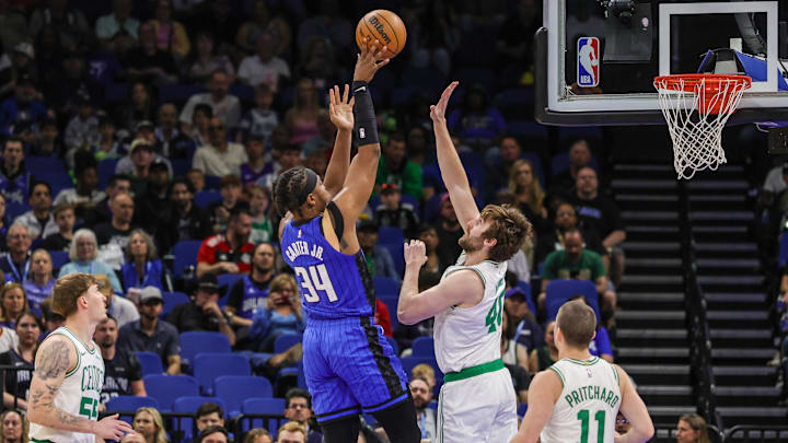 Orlando Magic center Wendell Carter Jr. (34) shoots against Boston Celtics center Luke Kornet (40) during the first quarter at Kia Center.
