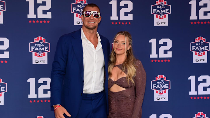 Jun 12, 2024; Foxborough, MA, USA; Former Patriots tight end Rob Gronkowski poses fore a photo with girlfriend Camille Kostek on the red carpet during the New England Patriots Hall of Fame induction Ceremony for Tom Brady Jun 12, 2024; Foxborough, MA, USA; Former Patriots tight end Rob Gronkowski poses fore a photo with girlfriend Camille Kostek on the red carpet during the New England Patriots Hall of Fame induction Ceremony for Tom Brady
