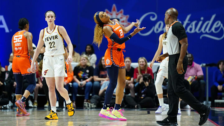 Jun 10, 2024; Uncasville, Connecticut, USA; Connecticut Sun guard DiJonai Carrington (21) imitates Indiana Fever guard Caitlin Clark (22) after a foul call in the second quarter at Mohegan Sun Arena. Mandatory Credit: David Butler II-Imagn Images