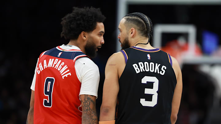 Jan 11, 2026; Phoenix, Arizona, USA; Phoenix Suns forward Dillon Brooks (3) argues with Washington Wizards forward Justin Champagnie (9) in the second half at Mortgage Matchup Center. Mandatory Credit: Mark J. Rebilas-Imagn Images