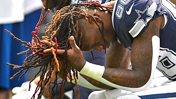 Dallas Cowboys wide receiver CeeDee Lamb sits on the bench before the start of the game against the Los Angeles Rams 