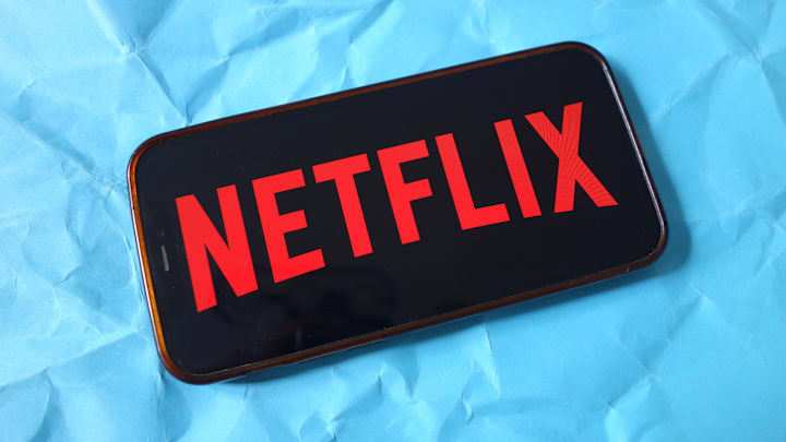 In this photo illustration, the Netflix company logo is seen...