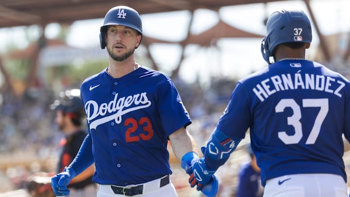 Feb 24, 2026; Phoenix, Arizona, USA; Los Angeles Dodgers outfielder Kyle Tucker (23) celebrates with Teoscar Hernandez after scoring against the Cleveland Guardians during a spring training game at Camelback Ranch-Glendale. Mandatory Credit: Mark J. Rebilas-Imagn Images Feb 24, 2026; Phoenix, Arizona, USA; Los Angeles Dodgers outfielder Kyle Tucker (23) celebrates with Teoscar Hernandez after scoring against the Cleveland Guardians during a spring training game at Camelback Ranch-Glendale. Mandatory Credit: Mark J. Rebilas-Imagn Images