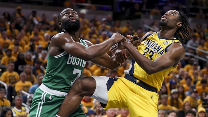 May 27, 2024; Indianapolis, Indiana, USA; Boston Celtics guard Jaylen Brown (7) and Indiana Pacers forward Aaron Nesmith (23) push each other away to intercept the ball during the second quarter during game four of the eastern conference finals for the 2024 NBA playoffs at Gainbridge Fieldhouse. Mandatory Credit: Trevor Ruszkowski-USA TODAY Sports