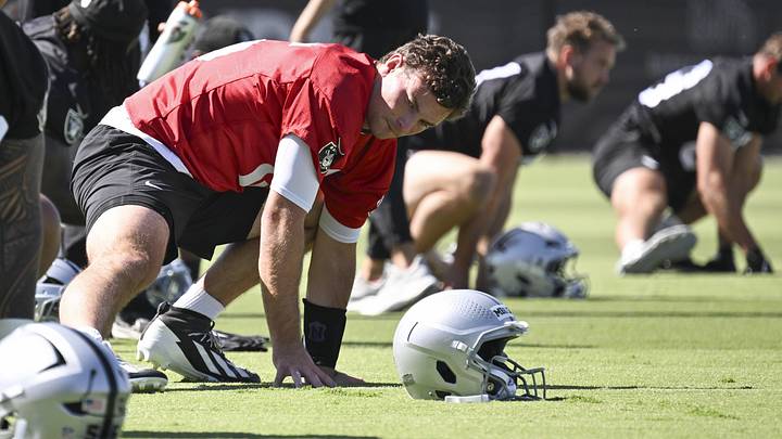 May 20, 2026; Henderson, NV, USA; Las Vegas Raiders quarterback Fernando Mendoza (15) stretches during organized team activities at Intermountain Health Performance Center. Mandatory Credit: Candice Ward-Imagn Images