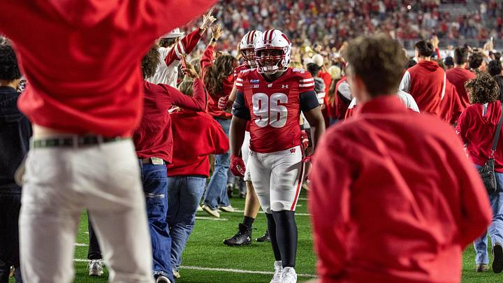 Oct 24, 2026; Madison, Wisconsin, USA;  Wisconsin Badgers students and fans rush the field at Camp Randall Stadium after the Badgers victory over the USC Trojans.  Mandatory Credit: Anthony Wahl-Imagn Images