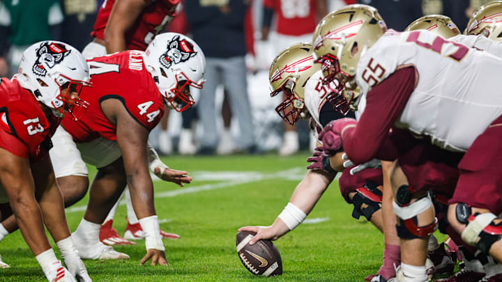 Nov 21, 2025; Raleigh, North Carolina, USA; Florida State Seminoles faces off against NC State Wolfpack during the second half of the game  at Carter-Finley Stadium. Mandatory Credit: Jaylynn Nash-Imagn Images