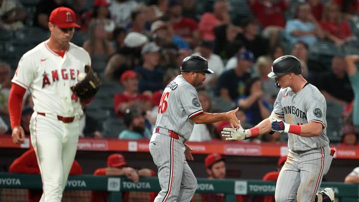 Minnesota Twins center fielder Walker Jenkins (11) is congratulated by third base coach Ramon Borrego (46) after hitting a two-run home run in the ninth inning against Los Angeles Angels pitcher Ben Joyce (44) at Angel Stadium on Sept. 17, 2026. Minnesota Twins center fielder Walker Jenkins (11) is congratulated by third base coach Ramon Borrego (46) after hitting a two-run home run in the ninth inning against Los Angeles Angels pitcher Ben Joyce (44) at Angel Stadium on Sept. 17, 2026.