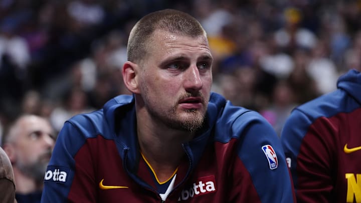Apr 11, 2025; Denver, Colorado, USA; Denver Nuggets center Nikola Jokic (15) on the bench in the second quarter against the Memphis Grizzlies at Ball Arena. Mandatory Credit: Ron Chenoy-Imagn Images