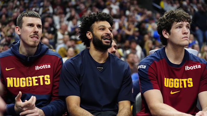 Apr 6, 2025; Denver, Colorado, USA; Denver Nuggets forward Vlatko Cancar (31), guard Jamal Murray (27) and center PJ Hall (13) on the bench during the fourth quarter against the Indiana Pacers at Ball Arena. Mandatory Credit: Ron Chenoy-Imagn Images