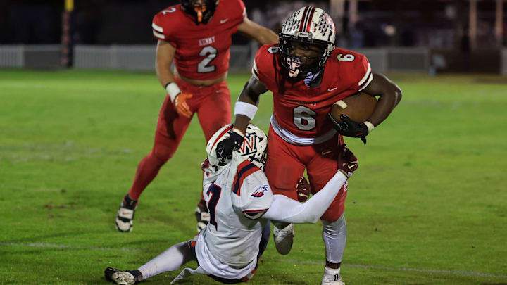Bishop Kenny's Caleb Mattison (6) rushes for yards against Wakulla's Auvion Thomas (7) during the third quarter of a high school football FHSAA Region 1-3A quarterfinal at Bishop Kenny High School, Friday, Nov. 14, 2025, in Jacksonville, Fla. The Bishop Kenny Crusaders cruised past the Wakulla War Eagles 43-19. Bishop Kenny's Caleb Mattison (6) rushes for yards against Wakulla's Auvion Thomas (7) during the third quarter of a high school football FHSAA Region 1-3A quarterfinal at Bishop Kenny High School, Friday, Nov. 14, 2025, in Jacksonville, Fla. The Bishop Kenny Crusaders cruised past the Wakulla War Eagles 43-19.