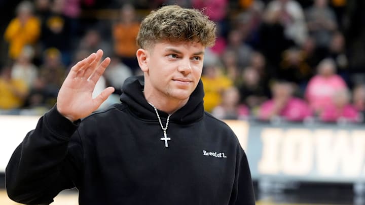 Former Iowa football player and Super Bowl LIX champion Cooper DeJean is interviewed on court during halftime of the Iowa women’s basketball game against UCLA Sunday, Feb. 23, 2025 at Carver-Hawkeye Arena in Iowa City, Iowa.
