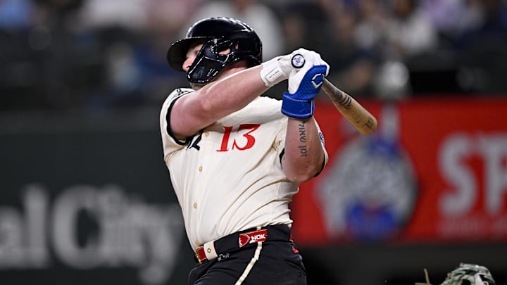 May 2, 2025; Arlington, Texas, USA; Texas Rangers first baseman Blaine Crim (13) strikes out in his first major league at bat during the third inning against the Seattle Mariners at Globe Life Field. 