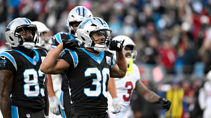Dec 22, 2024; Charlotte, North Carolina, USA;  Carolina Panthers running back Chuba Hubbard (30) reacts after running for a first down in overtime at Bank of America Stadium. Mandatory Credit: Bob Donnan-Imagn Images