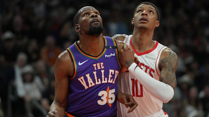 Mar 30, 2025; Phoenix, Arizona, USA; Phoenix Suns forward Kevin Durant (35) and Houston Rockets forward Jabari Smith Jr. (10) fight for position in the first half at Footprint Center. Mandatory Credit: Rick Scuteri-Imagn Images