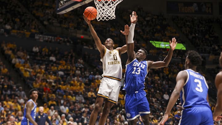 Feb 28, 2026; Morgantown, West Virginia, USA; West Virginia Mountaineers forward Brenen Lorient (0) shoots against BYU Cougars center Keba Keita (13) during the second half at Hope Coliseum. Mandatory Credit: Ben Queen-Imagn Images