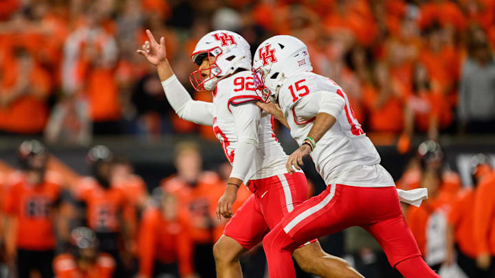 Houston Cougars place kicker Ethan Sanchez (92) celebrates his winning field goal kick in overtime with quarterback Jake Sock (15) against the Oregon State Beavers at Reser Stadium.