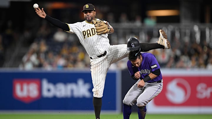 Apr 9, 2026; San Diego, California, USA; San Diego Padres shortstop Xander Bogaerts (2) collides with Colorado Rockies right fielder Tyler Freeman (2) while attempting to turn a double play at second base during the tenth inning at Petco Park. Mandatory Credit: Denis Poroy-Imagn Images