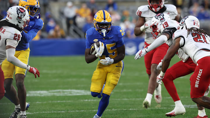 Oct 25, 2025; Pittsburgh, Pennsylvania, USA;  Pittsburgh Panthers running back Ja'Kyrian Turner (25) carries the ball against the North Carolina State Wolfpack during the third quarter at Acrisure Stadium. Mandatory Credit: Charles LeClaire-Imagn Images