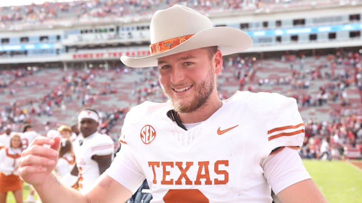 Nov 16, 2024; Fayetteville, Arkansas, USA; Texas Longhorns quarterback Quinn Ewers (3) celebrates after the game against the Arkansas Razorbacks at Donald W. Reynolds Razorback Stadium. Texas won 20-10. Mandatory Credit: Nelson Chenault-Imagn Images