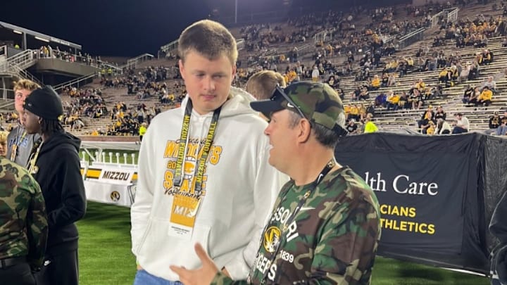 2027 OT Brendan Meaney alongside Missouri director of player personnel Ryan Trichel. 