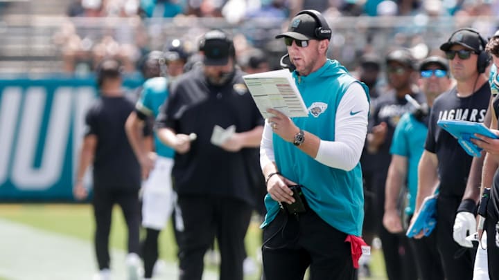 Sep 21, 2025; Jacksonville, Florida, USA; Jacksonville Jaguars head coach Liam Coen reads a play during the second quarter against the Houston Texans at EverBank Stadium. Mandatory Credit: Travis Register-Imagn Images