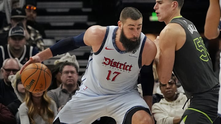 Feb 1, 2025; Minneapolis, Minnesota, USA; Washington Wizards center Jonas Valanciunas (17) works against Minnesota Timberwolves forward Luka Garza (55) in the third quarter at Target Center. Mandatory Credit: Bruce Kluckhohn-Imagn Images