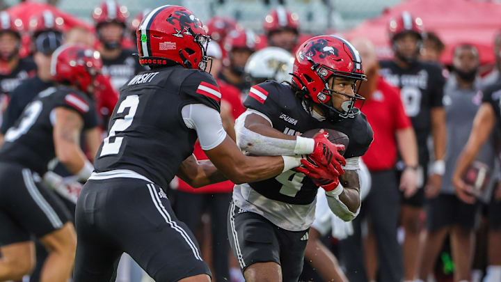 Jacksonville State Gamecocks quarterback Gavin Wimsatt (2) hands off to running back Cam Cook (4) Jacksonville State Gamecocks quarterback Gavin Wimsatt (2) hands off to running back Cam Cook (4)