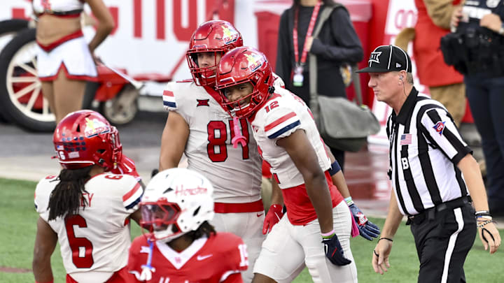 Oct 18, 2025; Houston, Texas, USA; Arizona Wildcats wide receiver Tre Spivey (12) celebrates after scoring a touchdown during the first quarter against the Houston Cougars at TDECU Stadium. Mandatory Credit: Maria Lysaker-Imagn Images Oct 18, 2025; Houston, Texas, USA; Arizona Wildcats wide receiver Tre Spivey (12) celebrates after scoring a touchdown during the first quarter against the Houston Cougars at TDECU Stadium. Mandatory Credit: Maria Lysaker-Imagn Images