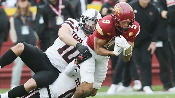 Iowa State Cyclones wide receiver Jayden Higgins (9) battle for a few yards as getting tackle by Texas Tech Red Raiders' linebacker Jacob Rodriguez (10) and defensive back Bralyn Lux (0) during the first quarter in the week-10 NCAA football at Jack Trice Stadium on Saturday, Nov. 2, 2024, in Ames, Iowa.