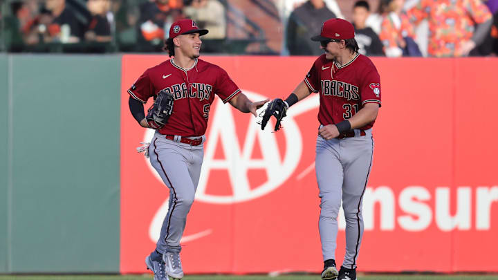 Jul 31, 2023; San Francisco, California, USA; Arizona Diamondbacks center fielder Alek Thomas (5) and Arizona Diamondbacks right fielder Jake McCarthy (31) celebrate after a play during the first inning against the San Francisco Giants at Oracle Park. Mandatory Credit: Sergio Estrada-Imagn Images Jul 31, 2023; San Francisco, California, USA; Arizona Diamondbacks center fielder Alek Thomas (5) and Arizona Diamondbacks right fielder Jake McCarthy (31) celebrate after a play during the first inning against the San Francisco Giants at Oracle Park. Mandatory Credit: Sergio Estrada-Imagn Images