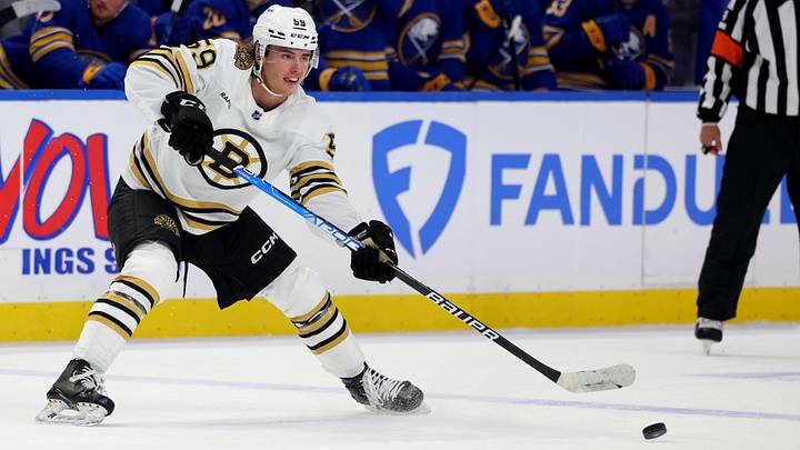 Sep 26, 2023; Buffalo, New York, USA;  Boston Bruins defenseman Frederic Brunet (59) makes a pass during the third period against the Buffalo Sabres at KeyBank Center. Mandatory Credit: Timothy T. Ludwig-Imagn Images