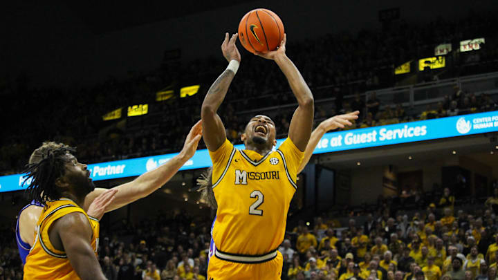 Dec 8, 2024; Columbia, Missouri, USA; Missouri Tigers guard Tamar Bates (2) grimaces while getting a shot up during a game against the Kansas Jayhawks at Mizzou Arena. 