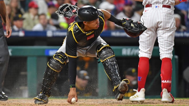 Pittsburgh Pirates catcher Endy Rodriguez (25) reaches for the ball in the dirt against the Philadelphia Phillies during the fifth inning at Citizens Bank Park. 
