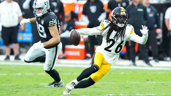 Oct 13, 2024; Paradise, Nevada, USA; Pittsburgh Steelers cornerback Donte Jackson (26) runs the ball back after intercepting a pass intended for Las Vegas Raiders tight end Brock Bowers (89) during the third quarter at Allegiant Stadium. Mandatory Credit: Stephen R. Sylvanie-Imagn Images