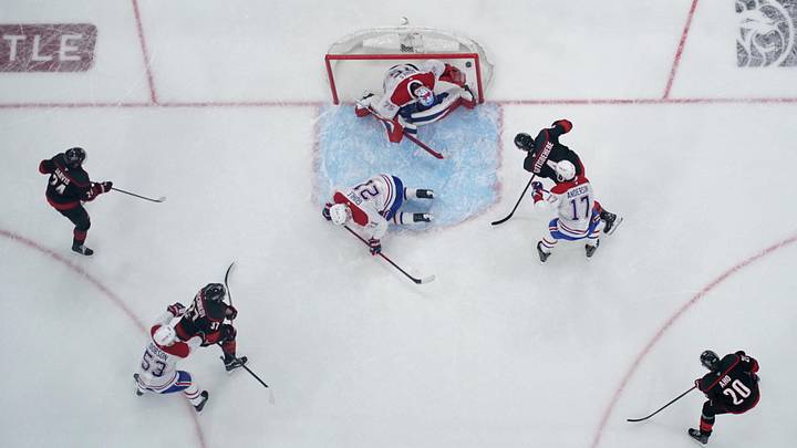 May 29, 2026; Raleigh, North Carolina, USA; Carolina Hurricanes defenseman Shayne Gostisbehere (4) scores a power play goal against Montreal Canadiens goaltender Jakub Dobes (75) in game five of the Eastern Conference Final of the 2026 Stanley Cup Playoffs during the second period at Lenovo Center. Mandatory Credit: James Guillory-Imagn Images May 29, 2026; Raleigh, North Carolina, USA; Carolina Hurricanes defenseman Shayne Gostisbehere (4) scores a power play goal against Montreal Canadiens goaltender Jakub Dobes (75) in game five of the Eastern Conference Final of the 2026 Stanley Cup Playoffs during the second period at Lenovo Center. Mandatory Credit: James Guillory-Imagn Images
