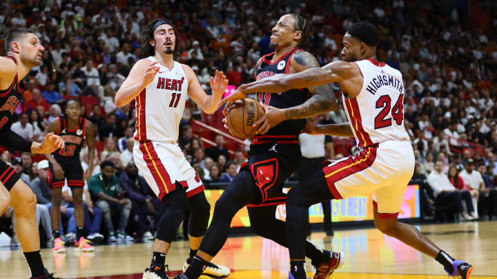 Apr 19, 2024; Miami, Florida, USA; Chicago Bulls forward DeMar DeRozan (11) drives to the basket past Miami Heat forward Haywood Highsmith (24) in the second quarter during a play-in game of the 2024 NBA playoffs at Kaseya Center. Mandatory Credit: Sam Navarro-USA TODAY Sports Apr 19, 2024; Miami, Florida, USA; Chicago Bulls forward DeMar DeRozan (11) drives to the basket past Miami Heat forward Haywood Highsmith (24) in the second quarter during a play-in game of the 2024 NBA playoffs at Kaseya Center. Mandatory Credit: Sam Navarro-USA TODAY Sports